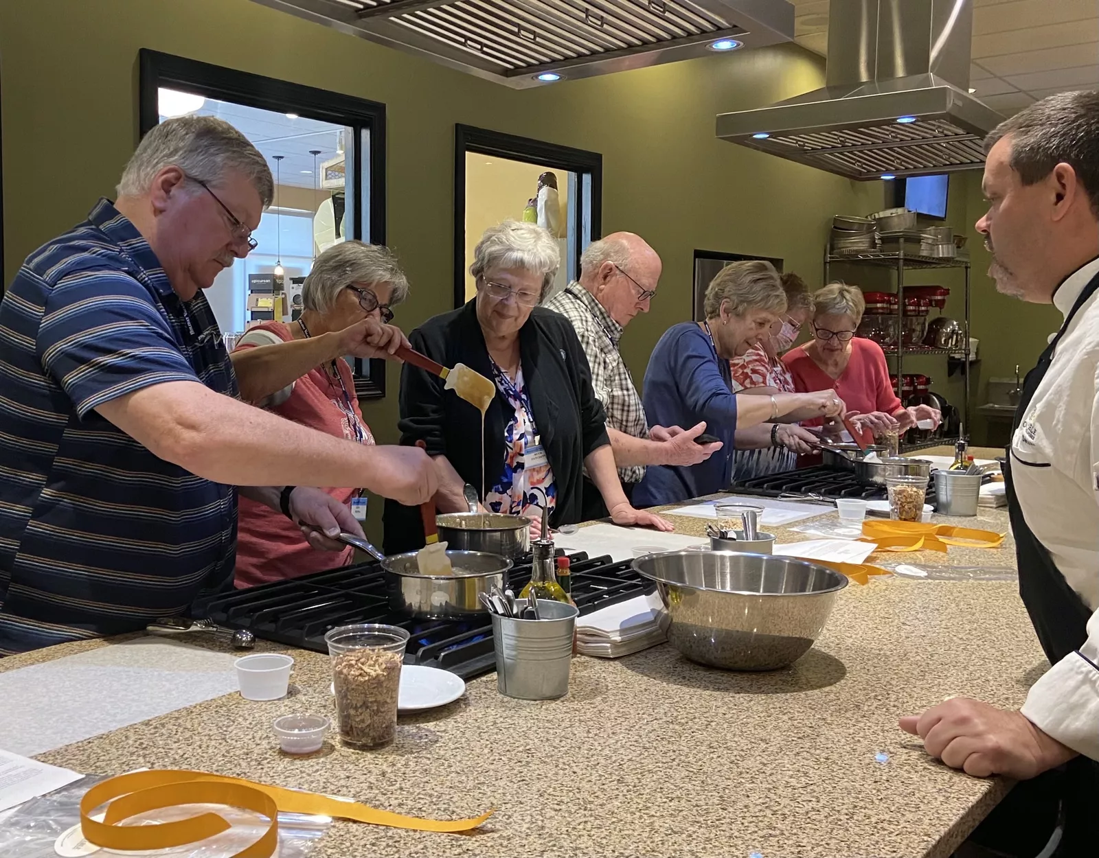 Guests at Chef Darin’s Kitchen Table making pralines