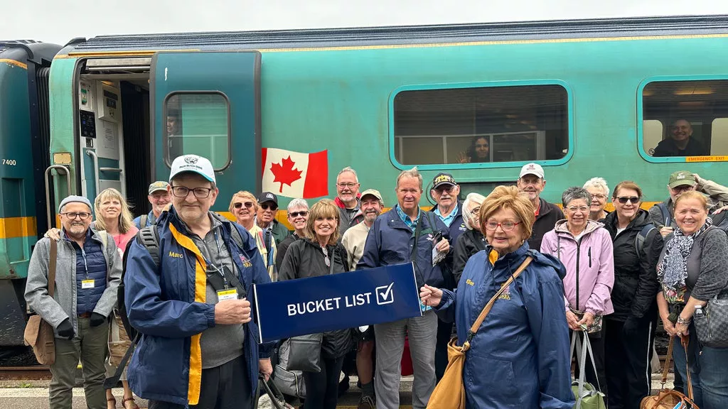 Guests next to Canadian train.