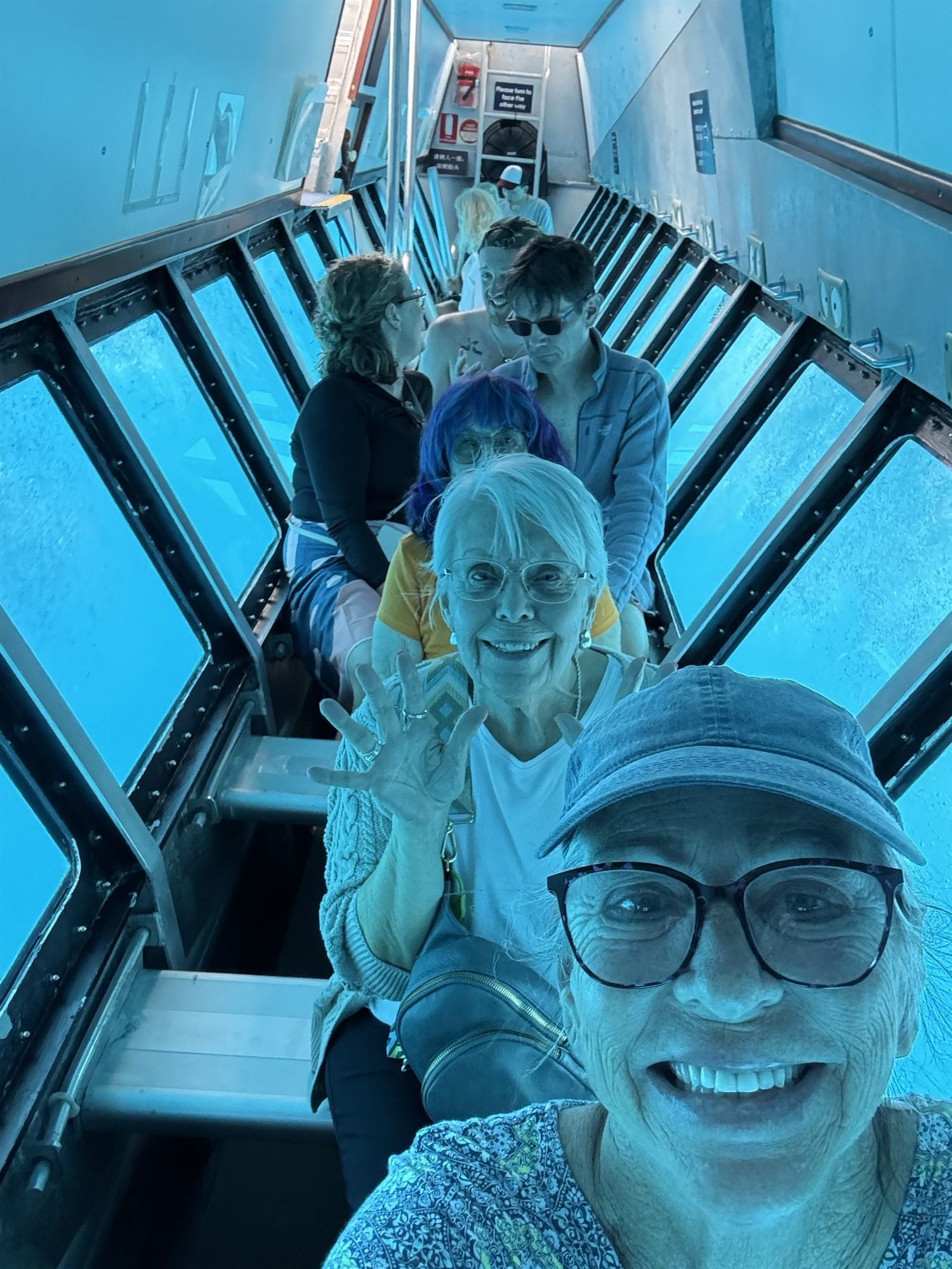 Holiday Vacations guest in glass-bottom boat, Great Barrier ReefHoliday Vacations guest in glass-bottom boat, Great Barrier Reef
