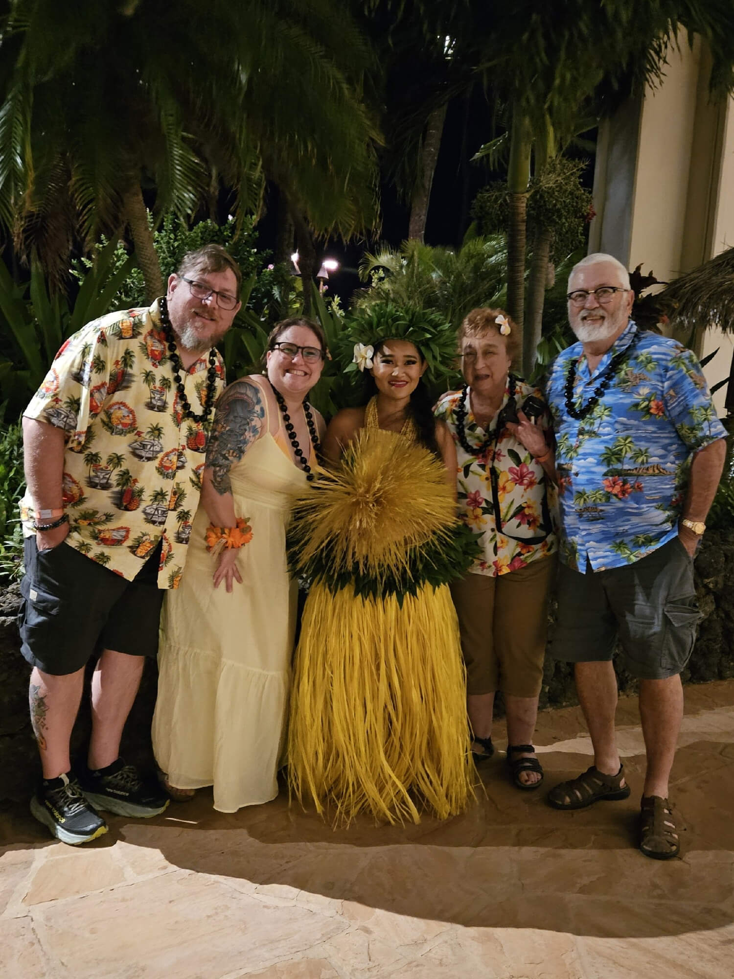Holiday Vacations guests with luau performer on Maui
