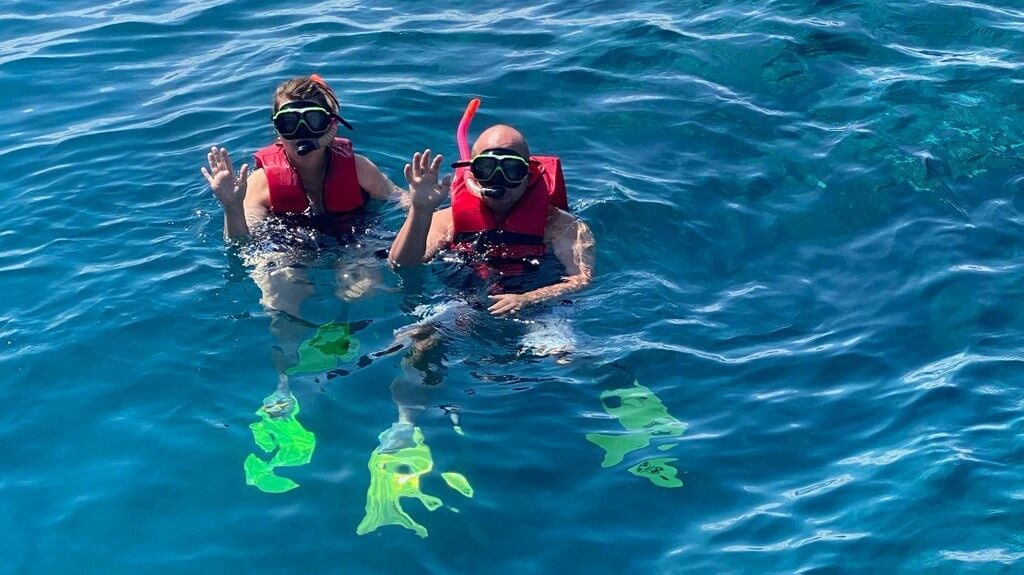 Guests snorkeling in the Great Barrier Reef