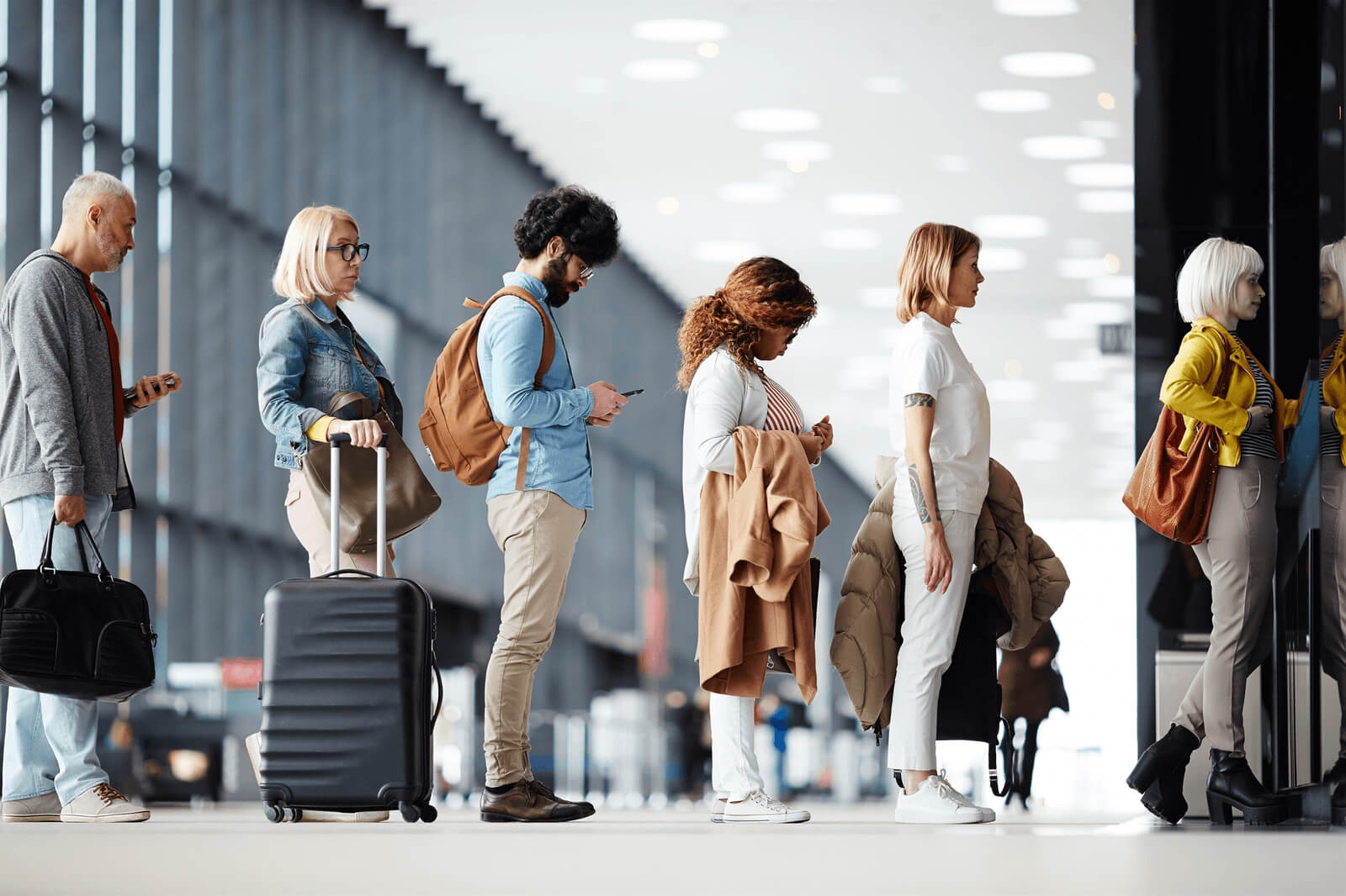 Travelers in line at airport